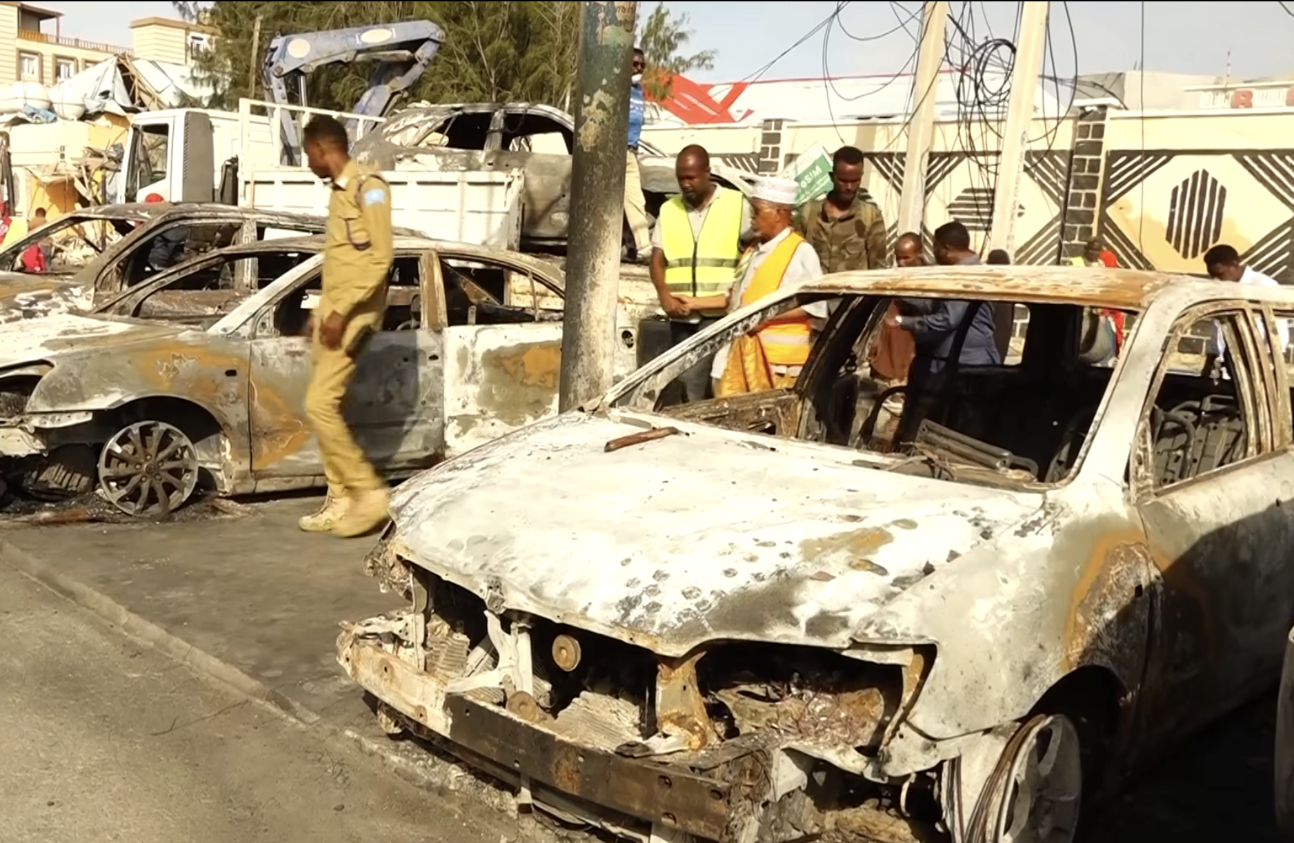 Burned vehicles, partially damaged buildings were the visible remnants.